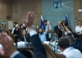 Member of Knesset Zvi Sukkot leads a vote during a meeting of the Education, Culture and Sports Committee at the Knesset, the Israeli parliament, in Jerusalem