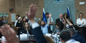 Member of Knesset Zvi Sukkot leads a vote during a meeting of the Education, Culture and Sports Committee at the Knesset, the Israeli parliament, in Jerusalem