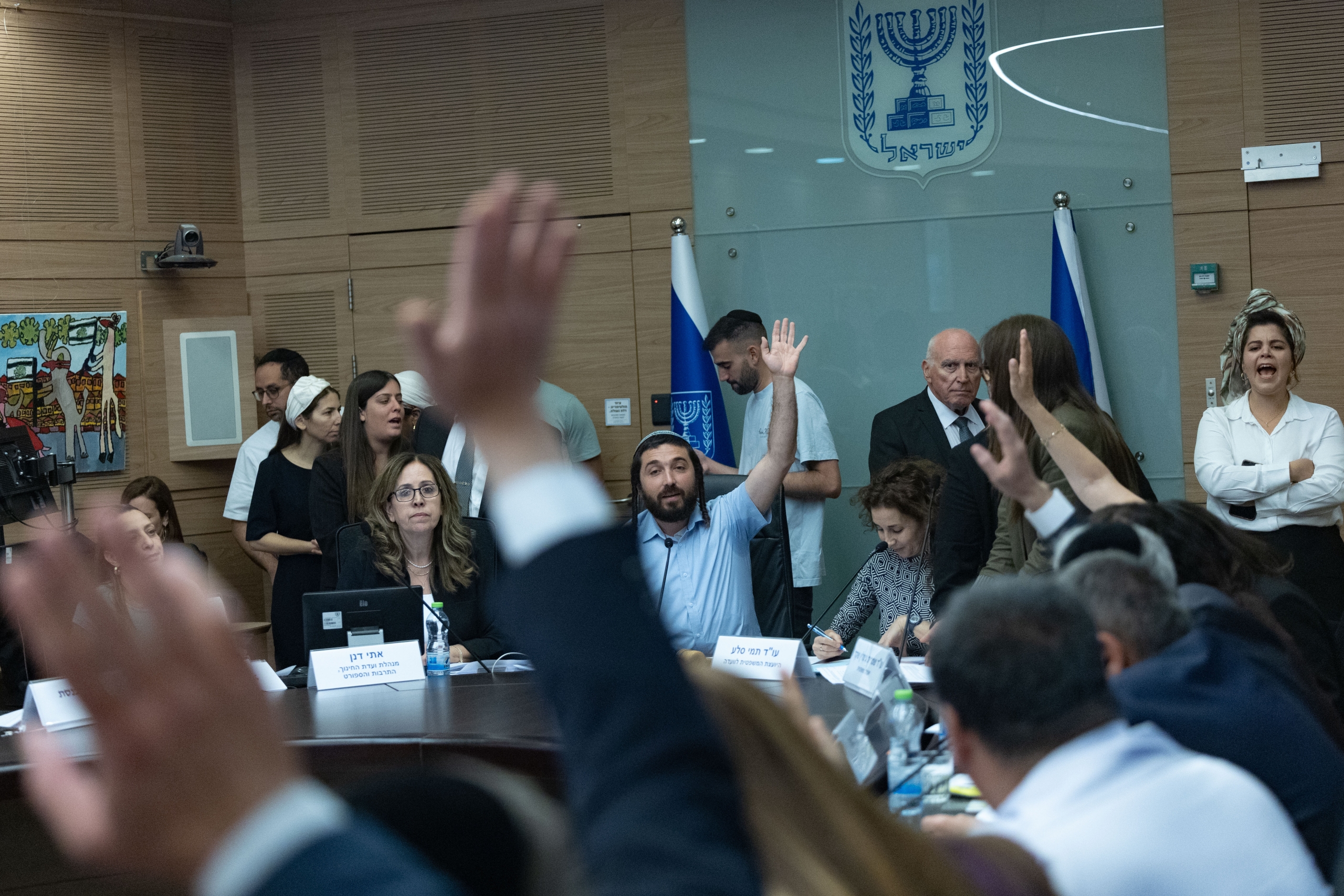 Member of Knesset Zvi Sukkot leads a vote during a meeting of the Education, Culture and Sports Committee at the Knesset, the Israeli parliament, in Jerusalem